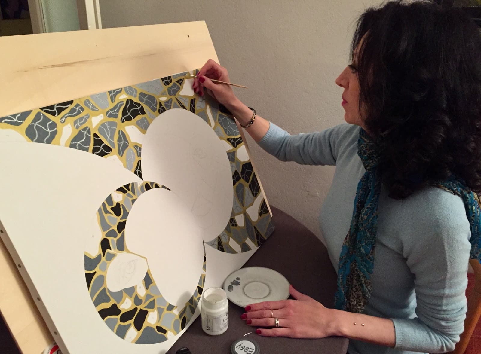 Mara Paletti painting in her studio